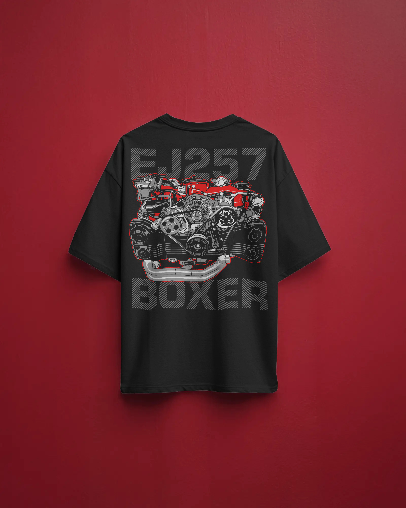 Back of black oversized cotton t-shirt featuring a bold graphic of a red EJ257 boxer engine, displayed on a graffiti-covered wall