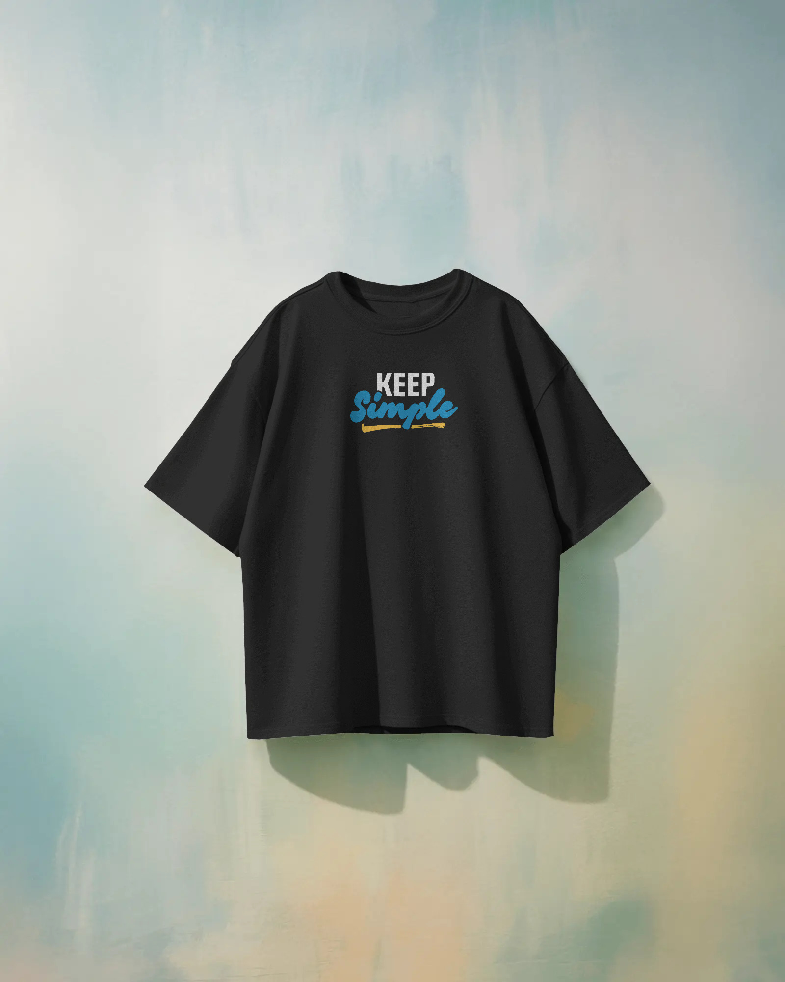Black oversized unisex t-shirt with bold back print “keep simple,” made from 100% eco-friendly cotton
