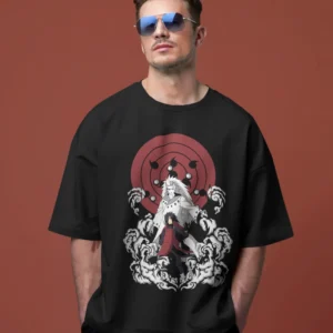 Man standing with his hand in his pocket, wearing an oversized black cotton t-shirt featuring a print of Ghost Uchiha Madara from the anime.